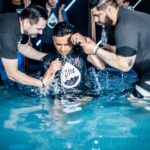 Illustrative outdoor Christian baptism scene