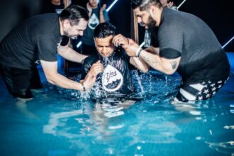 Illustrative outdoor Christian baptism scene