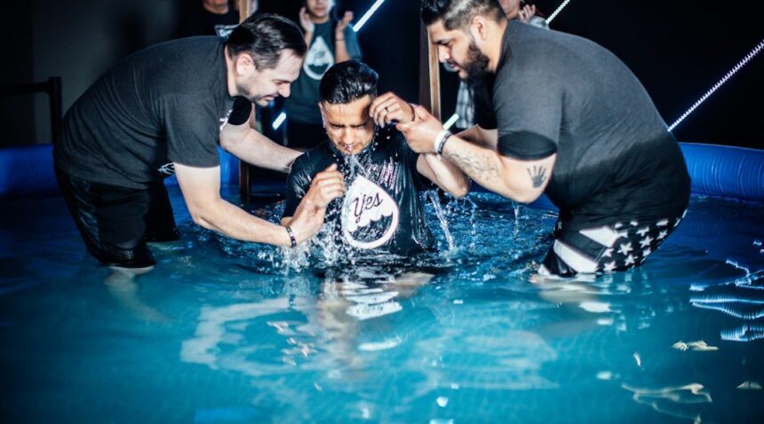Illustrative outdoor Christian baptism scene