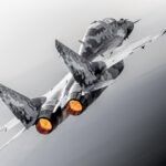 Jared Isaacman beside a MiG-29 fighter jet appearing at the 2026 Pacific Airshow in Huntington Beach