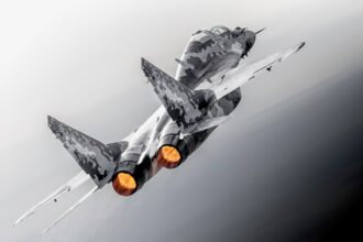 Jared Isaacman beside a MiG-29 fighter jet appearing at the 2026 Pacific Airshow in Huntington Beach