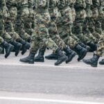 Military personnel in camouflage uniforms during deployment.