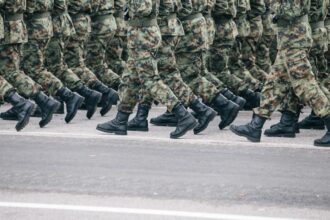 Military personnel in camouflage uniforms during deployment.
