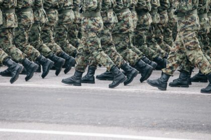 Military personnel in camouflage uniforms during deployment.