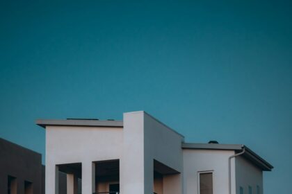 Modern multistory residential townhome architecture at dusk