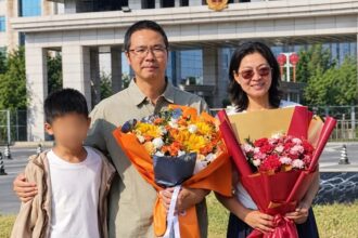 Pastor Lian Xuliang pictured with his family after returning home in Xi'an, China