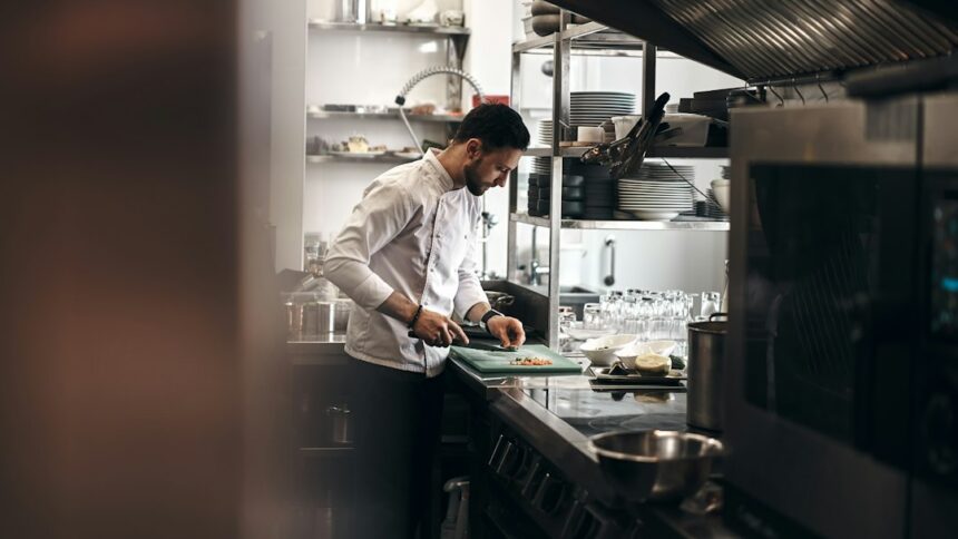 Restaurant chef preparing vegetables illustrating food-safety monitoring