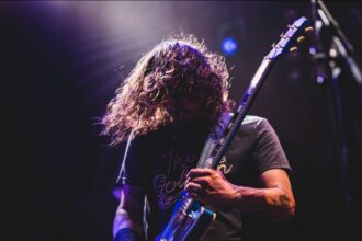 Rock guitarist performing live on stage