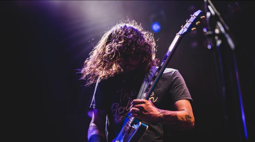 Rock guitarist performing live on stage