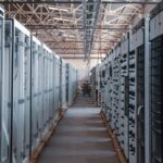 Rows of equipment racks inside a data center