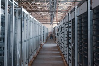 Rows of equipment racks inside a data center