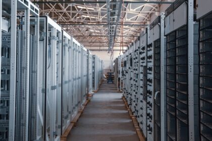 Rows of equipment racks inside a data center