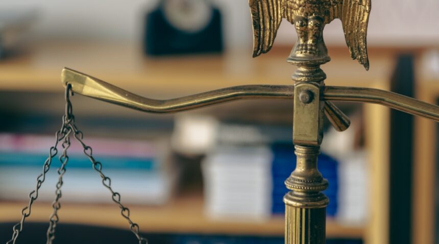 Scales of justice illustrating the American Bar Association’s law-school accreditation decision.