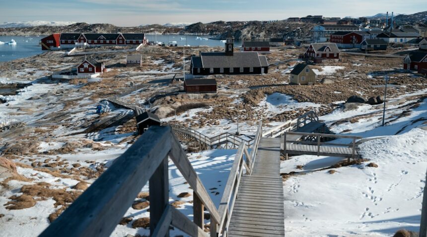 Snowy Greenland coastal village and Arctic landscape