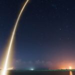 SpaceX rocket launch illuminating the night sky