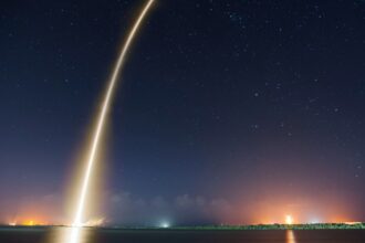 SpaceX rocket launch illuminating the night sky