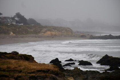 Storm-driven ocean waves crashing along a rocky coast