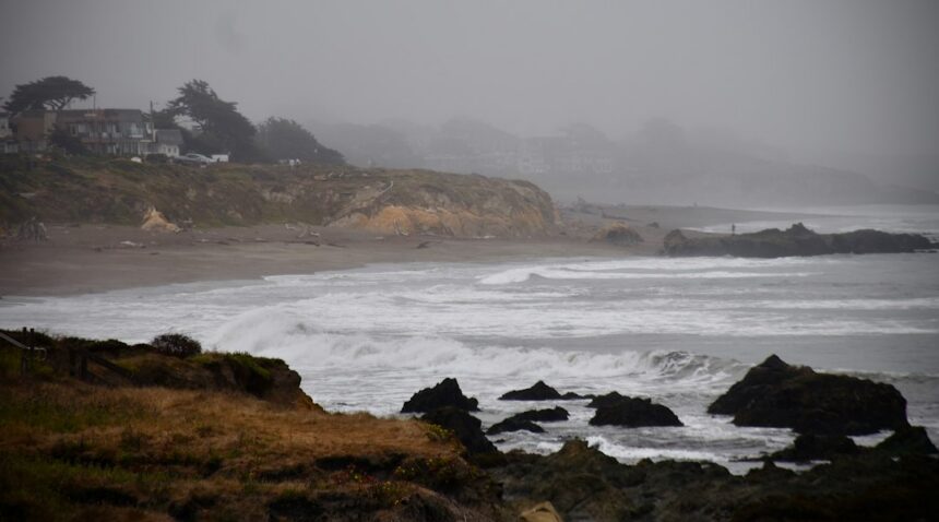 Storm-driven ocean waves crashing along a rocky coast