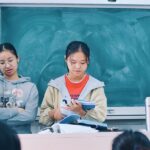Students reading and learning together in a classroom