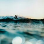 Surfer riding a wave off the Southern California coast