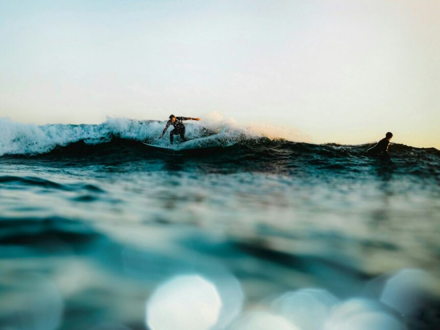 Surfer riding a wave off the Southern California coast