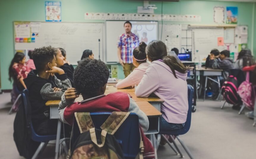 Teacher presenting to students in a classroom