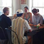 Teenagers and young adults talking together during a small-group gathering