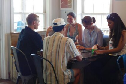 Teenagers and young adults talking together during a small-group gathering