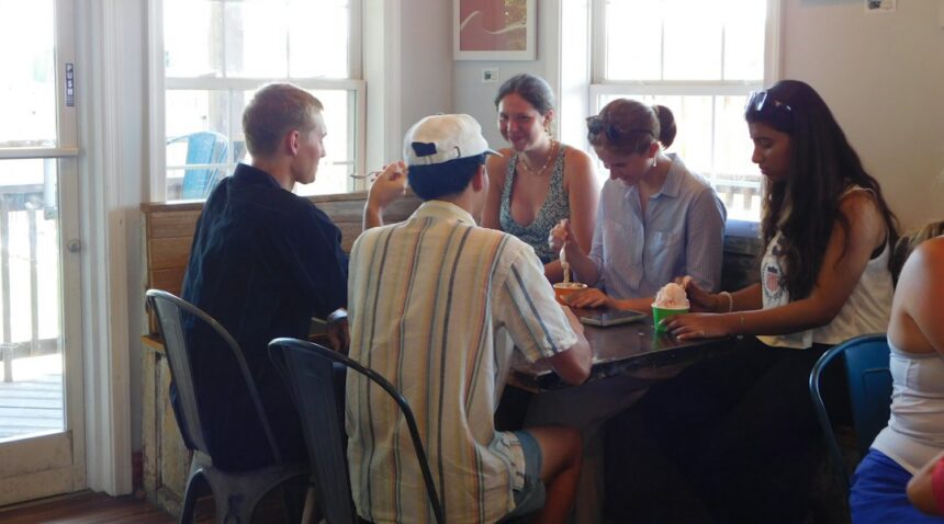 Teenagers and young adults talking together during a small-group gathering