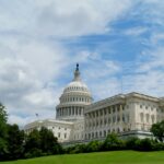 The United States Capitol beneath a dramatic cloudy sky in Washington.