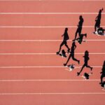Track athletes running in a stadium