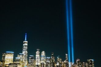 Tribute in Light beams rising above the New York City skyline in remembrance of September 11