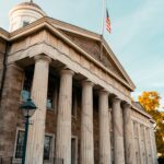 United States courthouse exterior with columns and an American flag