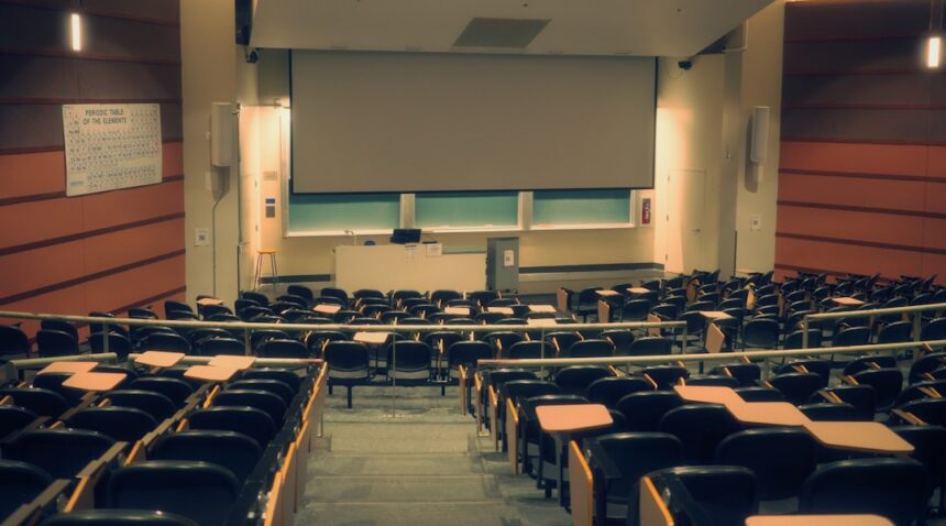 University lecture hall illustrating the University of California’s review of admissions requirements.