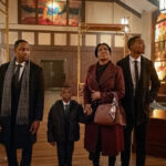 A family stands inside a church undergoing repairs in Tyler Perry’s The Gospel of Christmas.