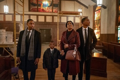 A family stands inside a church undergoing repairs in Tyler Perry’s The Gospel of Christmas.