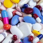 Assorted medication pills; illustrative photograph, not a depiction of Walmart’s covered prescriptions.