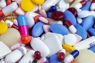 Assorted medication pills; illustrative photograph, not a depiction of Walmart’s covered prescriptions.