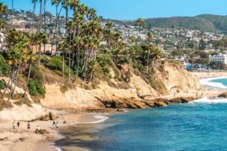 Coastal beach landscape; illustrative stock photograph, not the damaged Crystal Cove bluff.