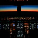 Commercial aircraft cockpit at night