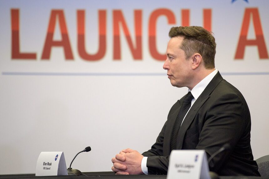 Elon Musk seated at a NASA launch briefing in May 2020.