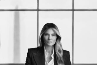 First Lady Melania Trump in her official black-and-white White House portrait.