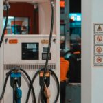 Fuel pump at a gas station at night; illustrative photograph.