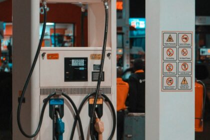 Fuel pump at a gas station at night; illustrative photograph.
