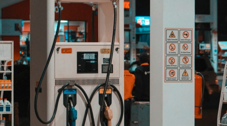 Fuel pump at a gas station at night; illustrative photograph.
