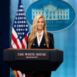 Katie Zacharia at the White House briefing podium on October 13, 2026. Official White House photo by Andrea Hanks.