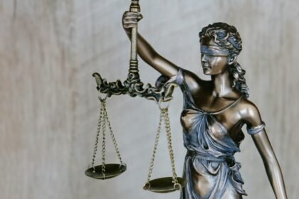 Lady Justice statue, illustrative photograph for a court and police review report