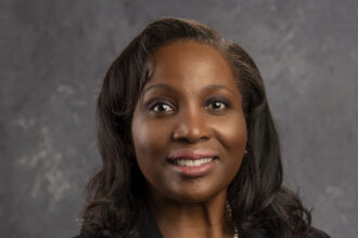Official 2022 portrait of Federal Reserve Governor Lisa D. Cook.