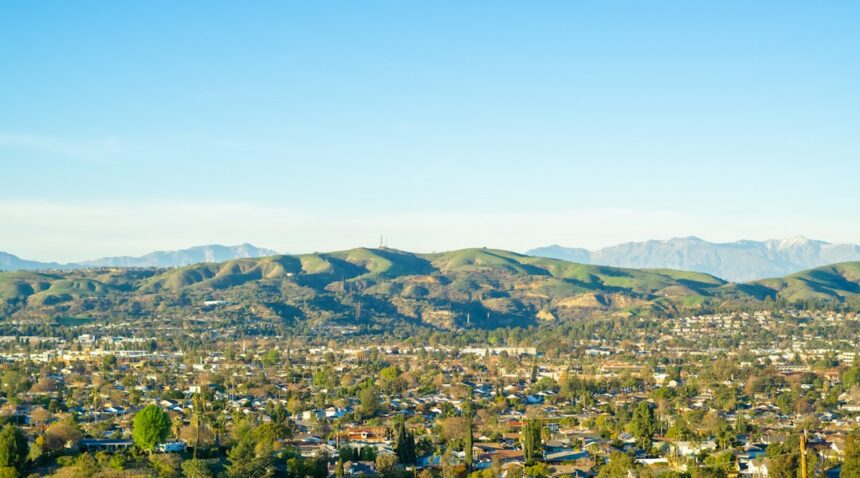 Orange County cityscape with mountains in the distance; regional illustration.