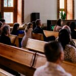 People seated in church pews